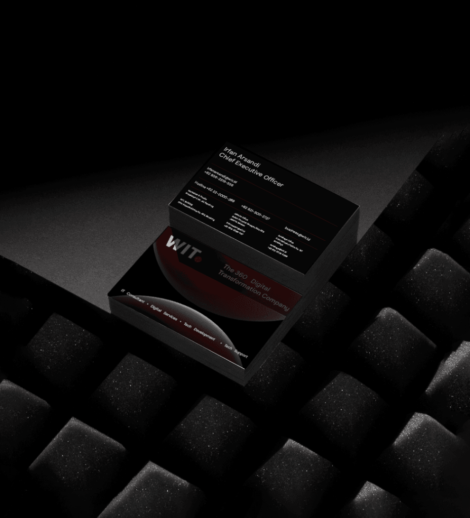 WIT business card on black keyboard keys
