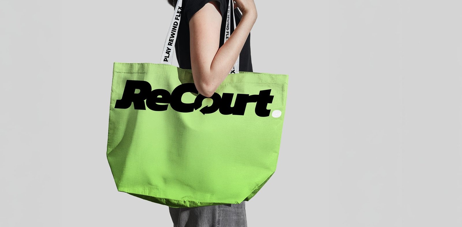 Lime green Recourt tote bag carried on the shoulder
